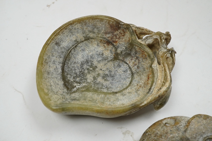 A 19th century Chinese reticulated celadon jade disc, 6.5cm diameter, a Ming style peach shaped brushwasher and a neolithic style carving. Condition - good